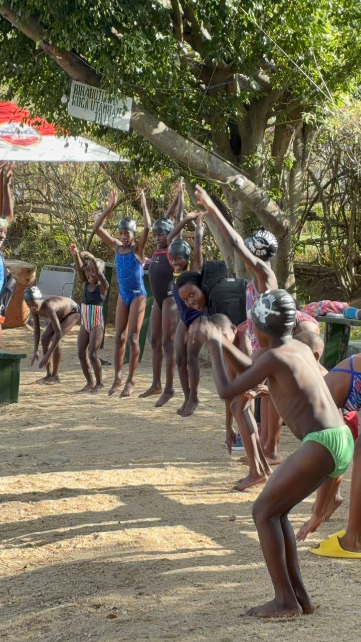 Ishyaka swimmers sharing a joyful warm-up