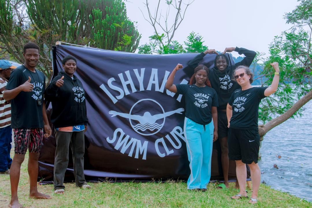 Ishyaka coaches with the banner